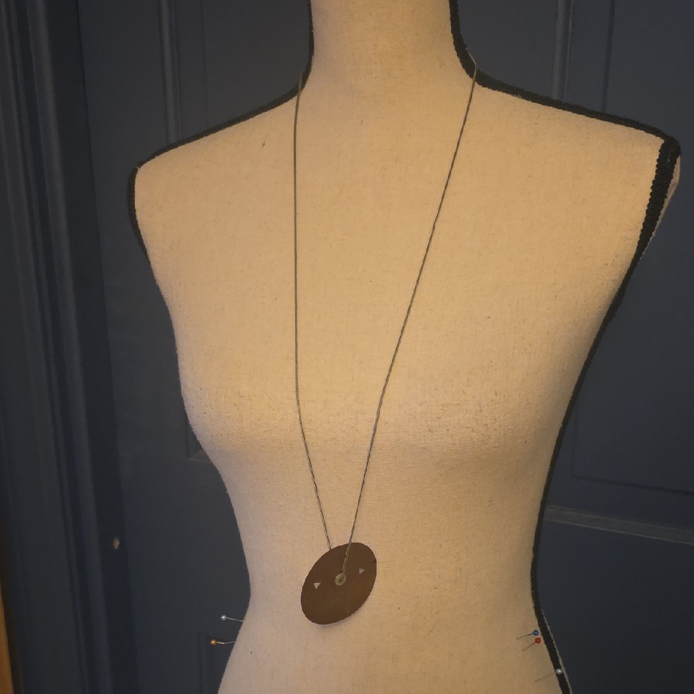 Silver Tone Chain Necklace With A Large Bronze Pendant